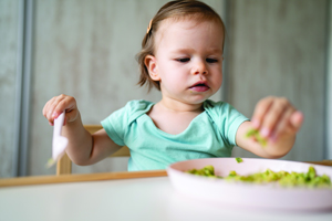 Girl Picking At Food